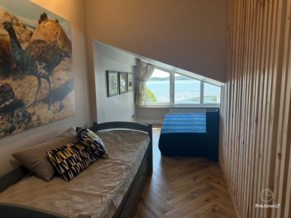 Ein stilvolles Apartment für vier Personen in Pervalka am Ufer der Lagune. Wohnung mit Terrasse für zwei Personen in Juodkrante