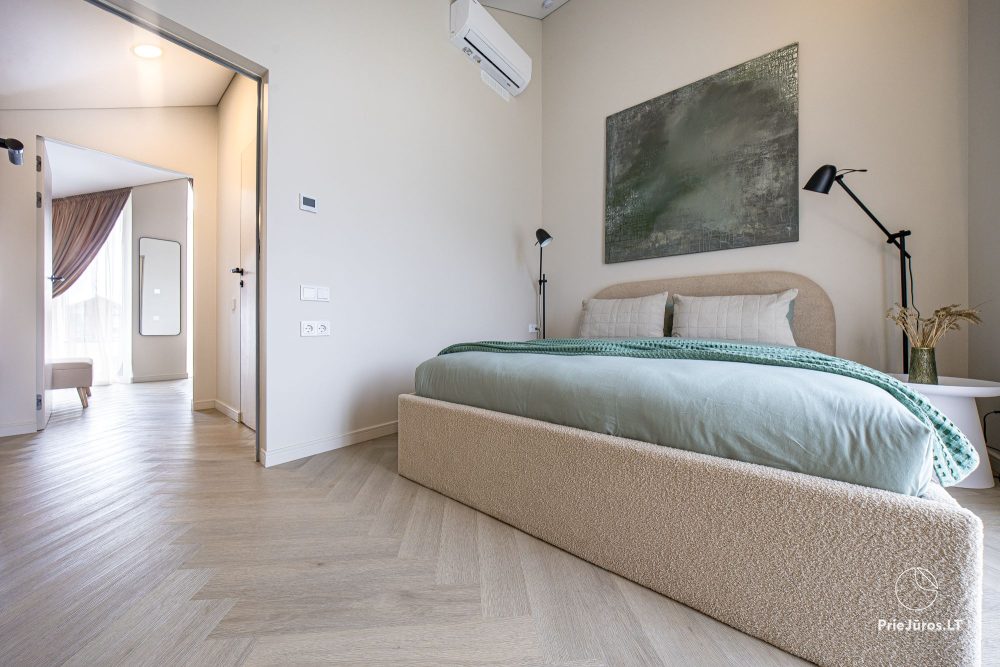 Novelė home - Geräumiges Zweizimmer-Cottage mit Terrasse für vier Personen in Monciškėse, im neuen Viertel J7 Beržas mit Pools und Saunen, Grill