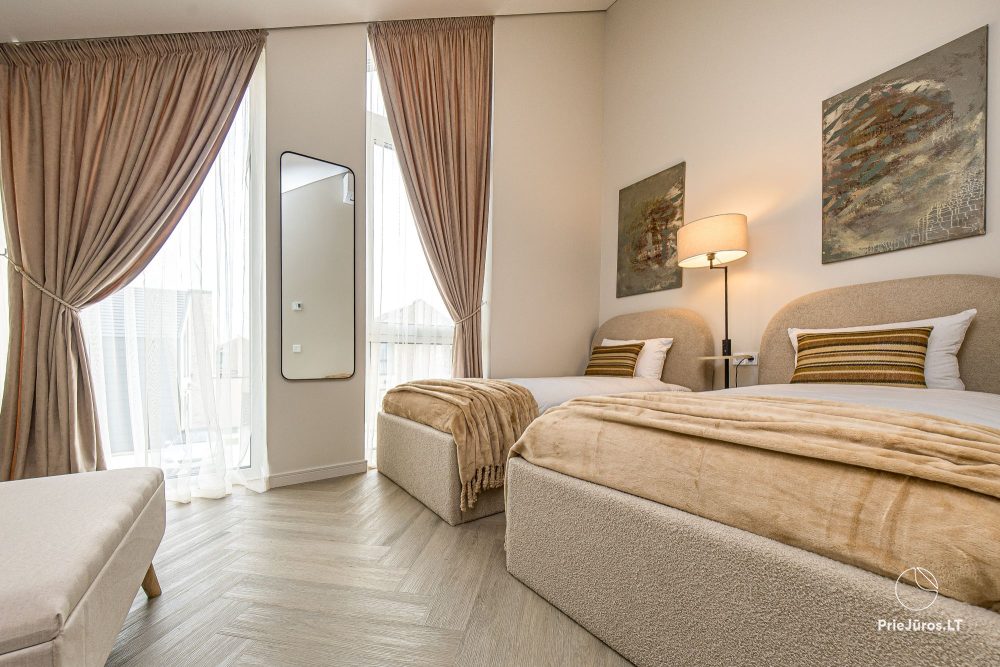 Novelė home - Geräumiges Zweizimmer-Cottage mit Terrasse für vier Personen in Monciškėse, im neuen Viertel J7 Beržas mit Pools und Saunen, Grill