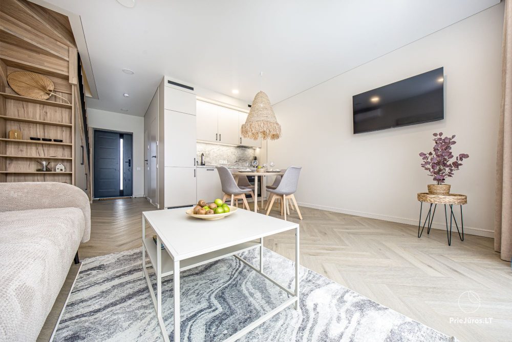 Novelė home - Geräumiges Zweizimmer-Cottage mit Terrasse für vier Personen in Monciškėse, im neuen Viertel J7 Beržas mit Pools und Saunen, Grill