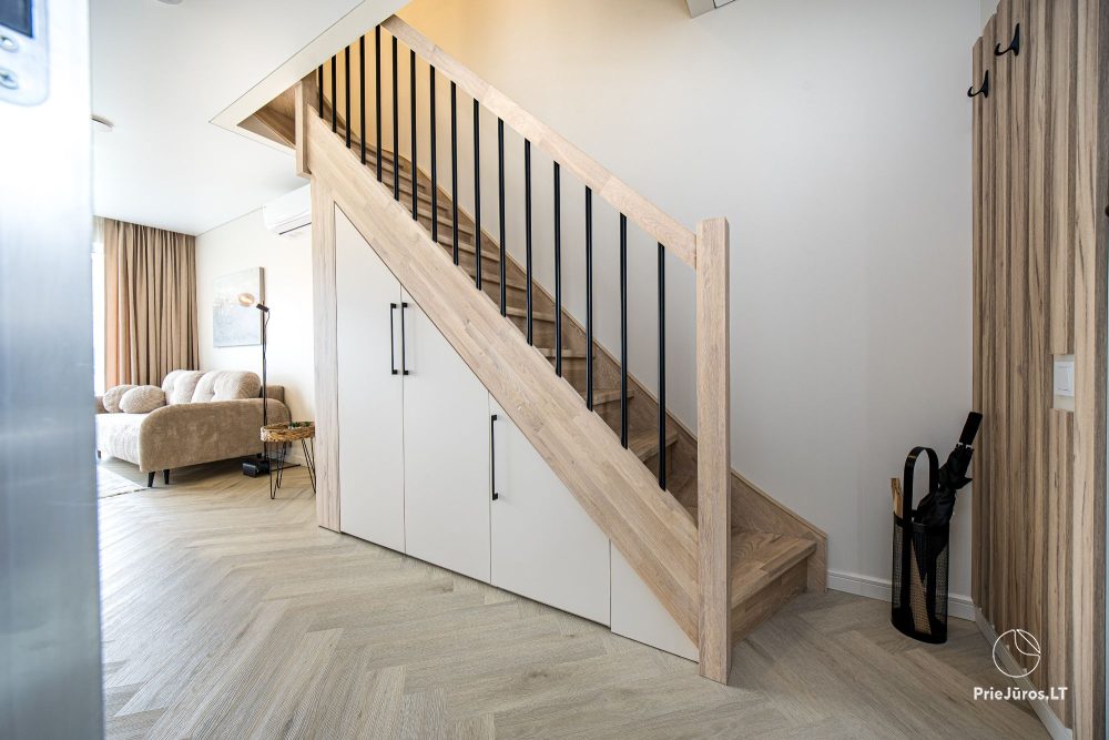 Novelė home - Geräumiges Zweizimmer-Cottage mit Terrasse für vier Personen in Monciškėse, im neuen Viertel J7 Beržas mit Pools und Saunen, Grill