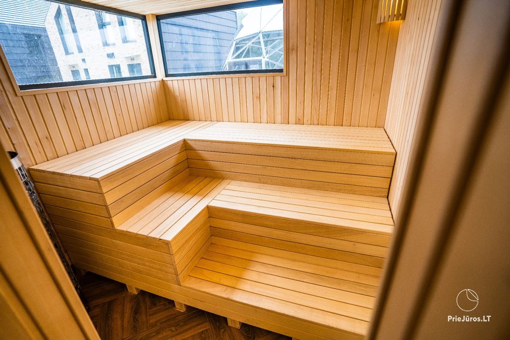 Novelė home - Geräumiges Zweizimmer-Cottage mit Terrasse für vier Personen in Monciškėse, im neuen Viertel J7 Beržas mit Pools und Saunen, Grill