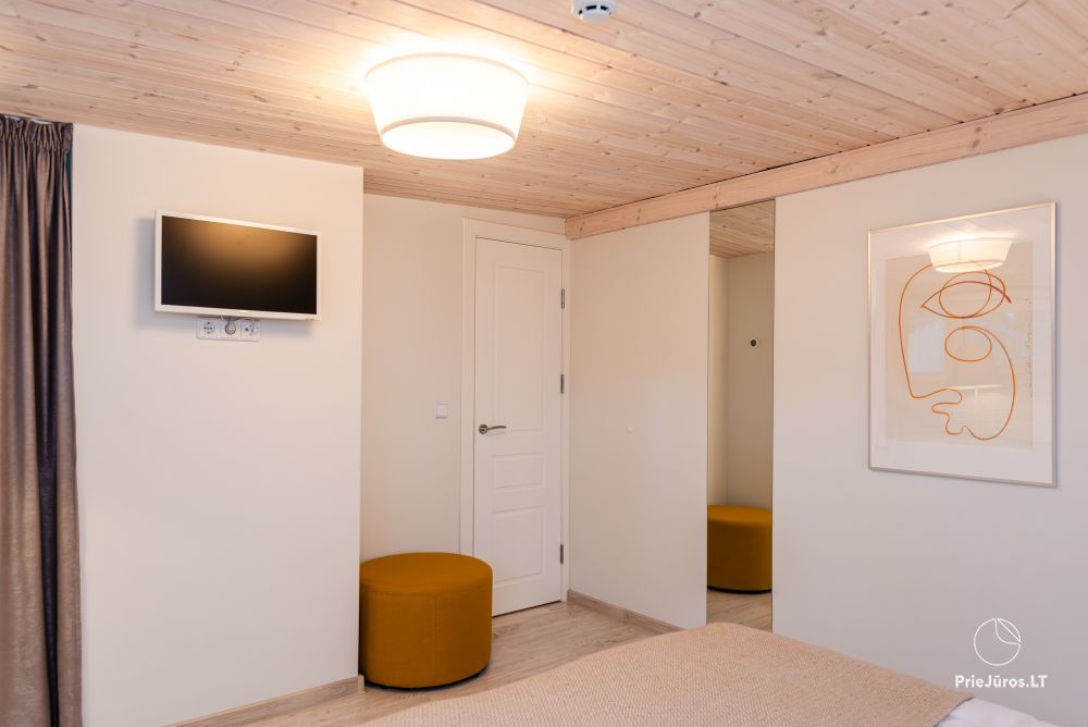 Family Beach House mit beheiztem Pool in Kunigiskiai