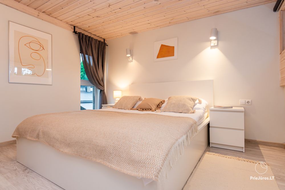 Family Beach House mit beheiztem Pool in Kunigiskiai
