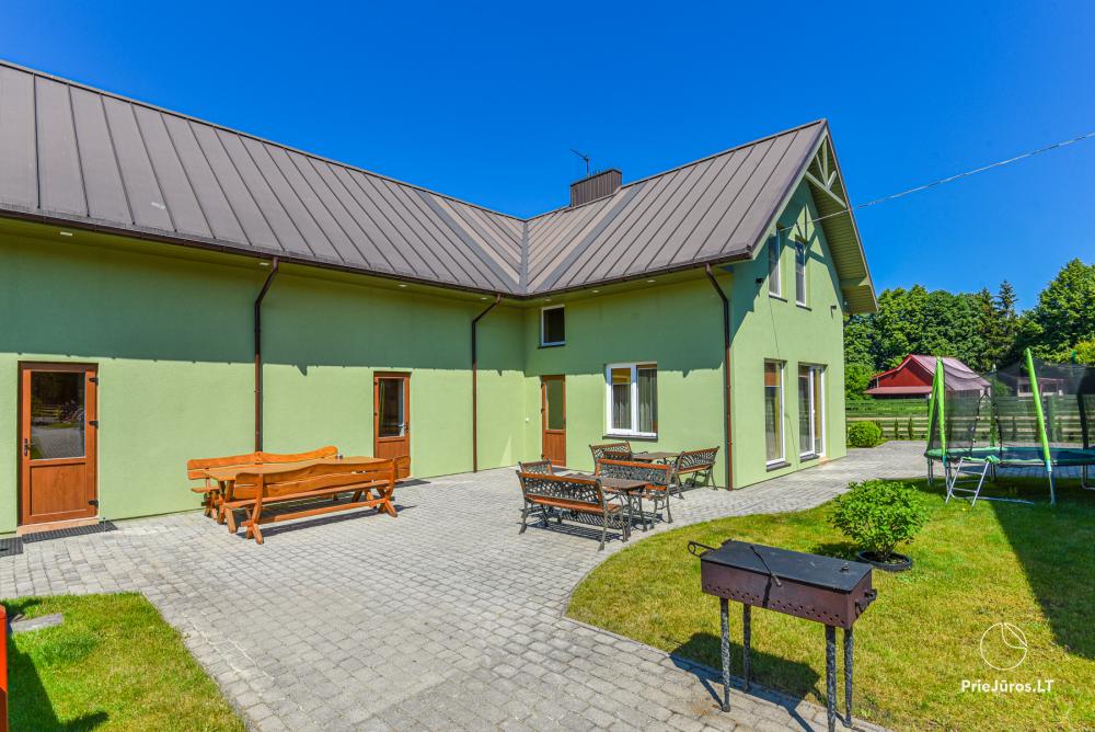 Dziugutis. Zimmer und Holzhäuser zur Miete in Sventoji