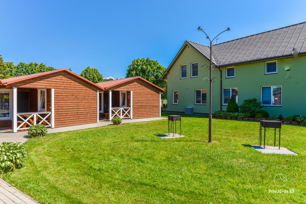Dziugutis. Zimmer und Holzhäuser zur Miete in Sventoji