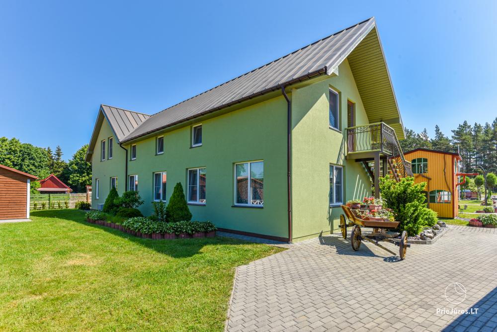 Dziugutis. Zimmer und Holzhäuser zur Miete in Sventoji