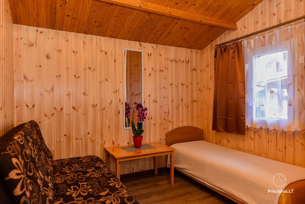Dziugutis. Zimmer und Holzhäuser zur Miete in Sventoji