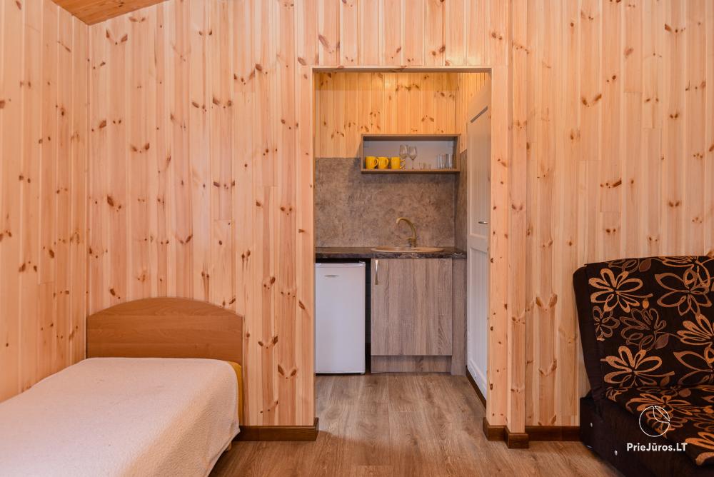 Dziugutis. Zimmer und Holzhäuser zur Miete in Sventoji