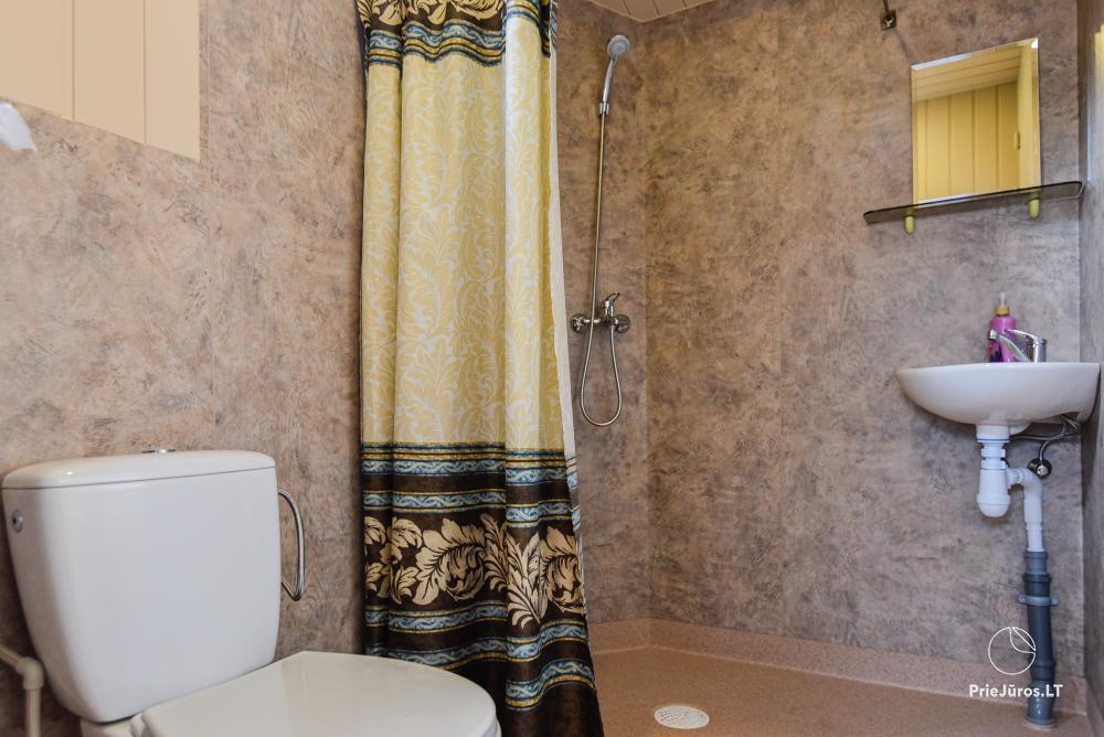 Dziugutis. Zimmer und Holzhäuser zur Miete in Sventoji