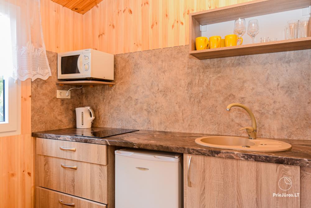 Dziugutis. Zimmer und Holzhäuser zur Miete in Sventoji