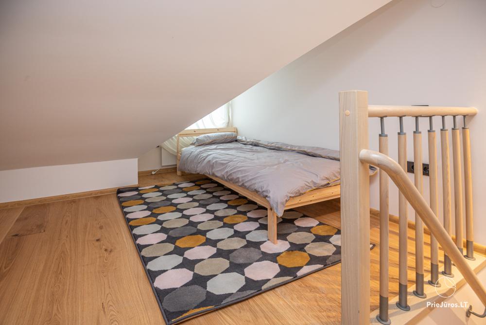 3-Zimmer-Ferienhaus in Pervalka mit Kamin und Sauna