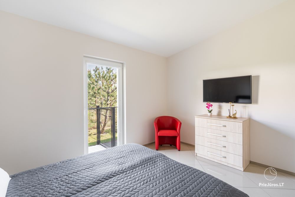 Ferienhaus mit Terrasse und 2-Zimmerwohnung mit eigenem Garten in Palanga